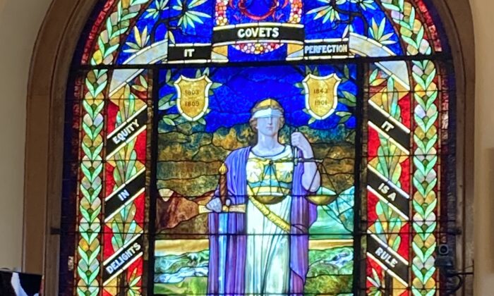 This stained-glass window depicts "lady justice" in the Xenia, Ohio, courthouse on July 22, 2022. David Lee Myers was convicted of murder in this courthouse in 1996. He protests his innocence. (Janice Hisle/The Epoch Times)