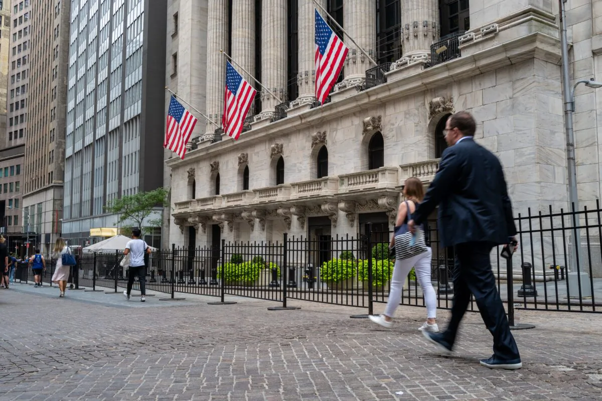 People walk outside of the New York Stock Exchange on July 25, 2022. (Spencer Platt/Getty Images)