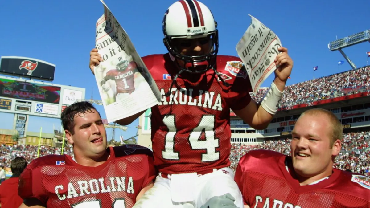 South Carolina quarterback Phil Petty, #14, is carried off the field by teammates after beating Ohio State 31-28 in the Outback Bowl at Raymond James Stadium in Tampa, Fla., on Jan. 1, 2002. (Scott Halleran/Getty Images)