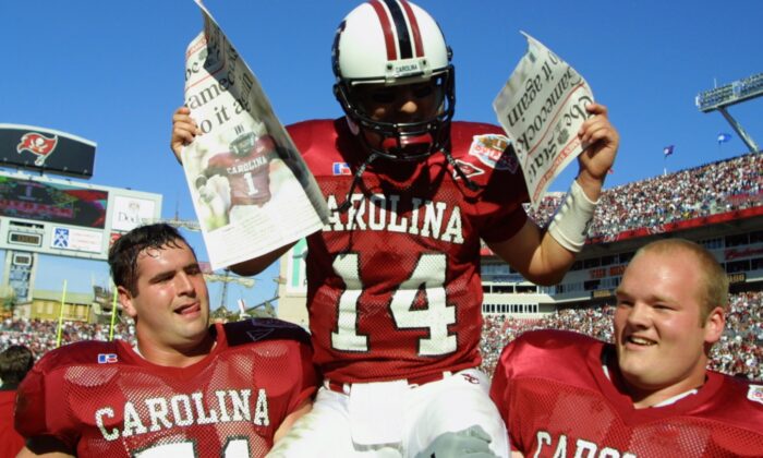South Carolina quarterback Phil Petty, #14, is carried off the field by teammates after beating Ohio State 31-28 in the Outback Bowl at Raymond James Stadium in Tampa, Fla., on Jan. 1, 2002. (Scott Halleran/Getty Images)