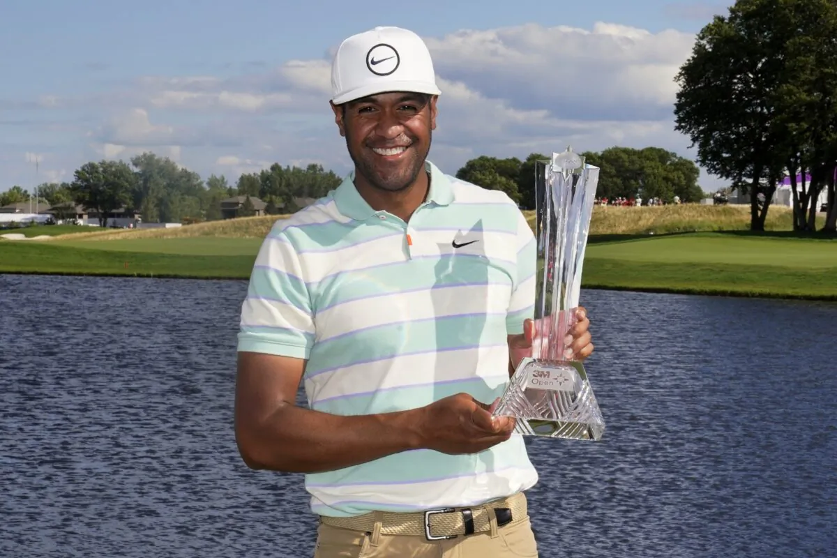 Tony Finau poses for photos with the trophy after his win in the 3M Open golf tournament at the Tournament Players Club in Blaine, Minn., Sunday, July 24, 2022. (Abbie Parr/AP Photo)