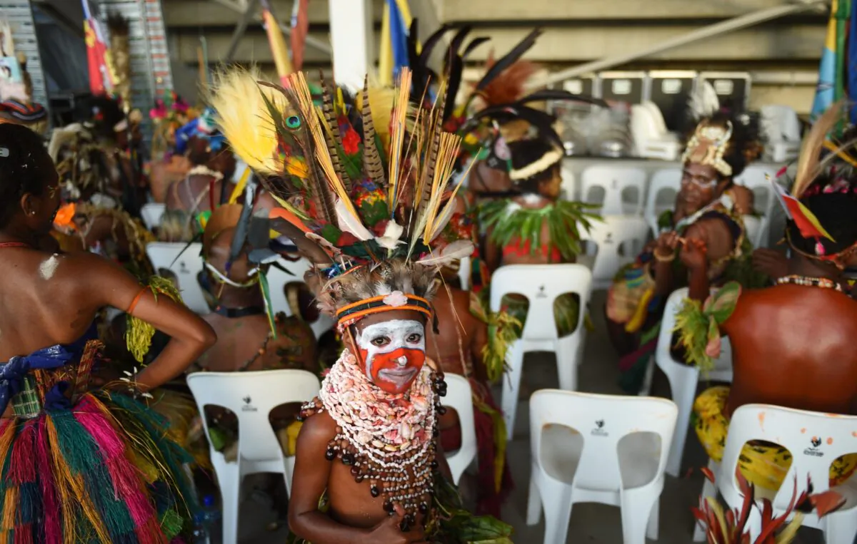 A boy in traditional dress waits to participate at an event at the sports stadium to mark 40 years of independence in Port Moresby, Papua New Guinea, on Sept. 16, 2015. It was on this day in 1975 that Papua New Guinea gained independence from Australia. (AAP Image/Mick Tsikas) 