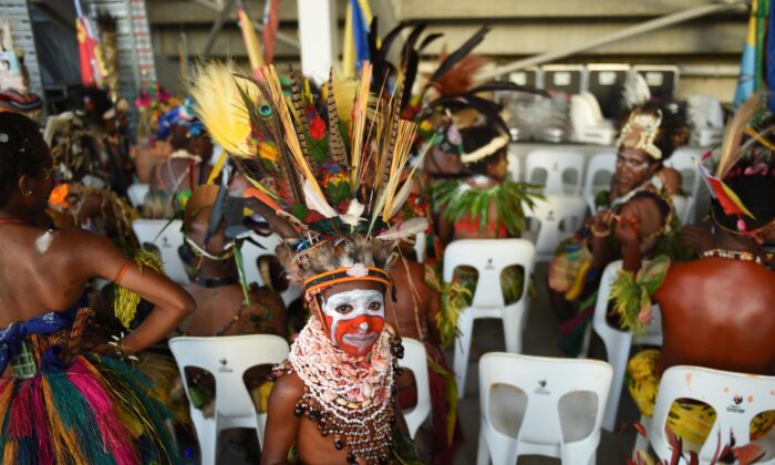 A boy in traditional dress waits to participate at an event at the sports stadium to mark 40 years of independence in Port Moresby, Papua New Guinea, on Sept. 16, 2015. It was on this day in 1975 that Papua New Guinea gained independence from Australia. (AAP Image/Mick Tsikas) 