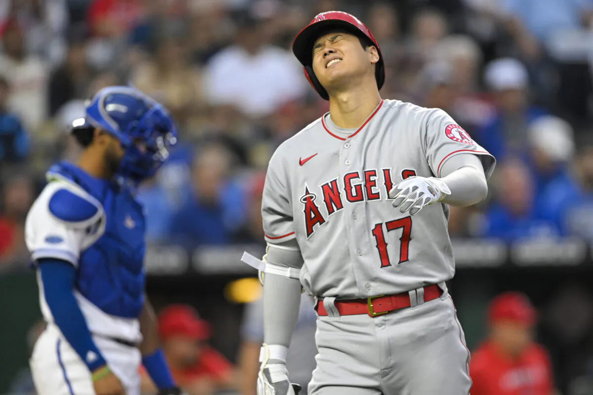 Los Angeles Angels' Shohei Ohtani (17) reacts after hitting a pitch off his leg during the third inning of a baseball game against the Kansas City Royals, in Kansas City, Mo., on Monday, July 25, 2022. (Reed Hoffmann/AP Photos)