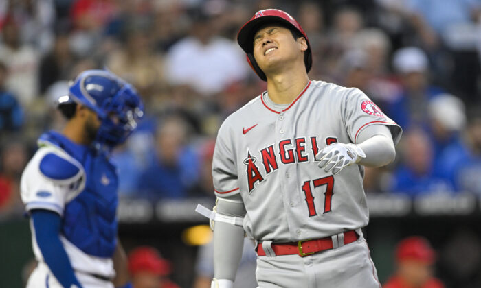 Los Angeles Angels' Shohei Ohtani (17) reacts after hitting a pitch off his leg during the third inning of a baseball game against the Kansas City Royals, in Kansas City, Mo., on Monday, July 25, 2022. (Reed Hoffmann/AP Photos)