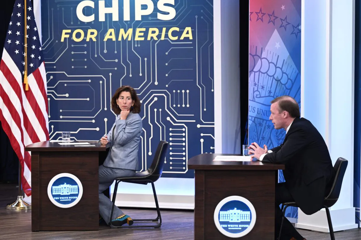Secretary of Commerce Gina Raimondo listens as national security adviser Jake Sullivan speaks at a virtual meeting with President Joe Biden, CEOs, and labor leaders on the CHIPS for America Act in the Eisenhower Executive Office Building in Washington, on July 25, 2022. (Brendan Smialowski/AFP/Getty Images)