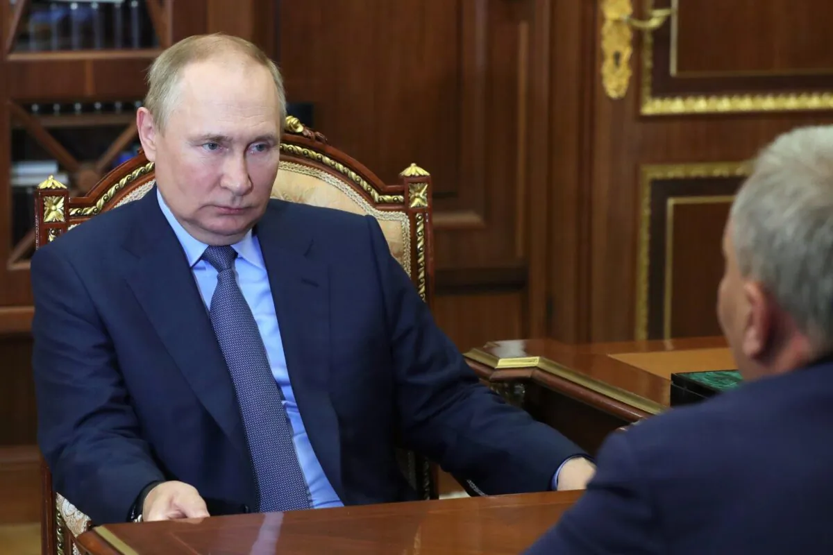 Russian President Vladimir Putin listens to Yuri Borisov, the new CEO of the Russian State Space Corporation "Roscosmos," at the Kremlin in Moscow on July 26, 2022. (Mikhail Klimentyev/Sputnik/Kremlin Pool Photo via AP)