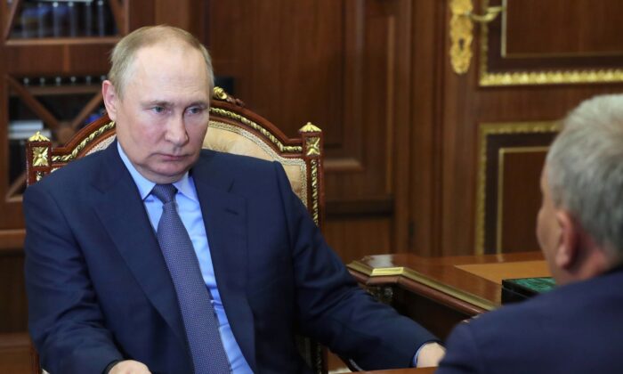 Russian President Vladimir Putin listens to Yuri Borisov, the new CEO of the Russian State Space Corporation "Roscosmos," at the Kremlin in Moscow on July 26, 2022. (Mikhail Klimentyev/Sputnik/Kremlin Pool Photo via AP)