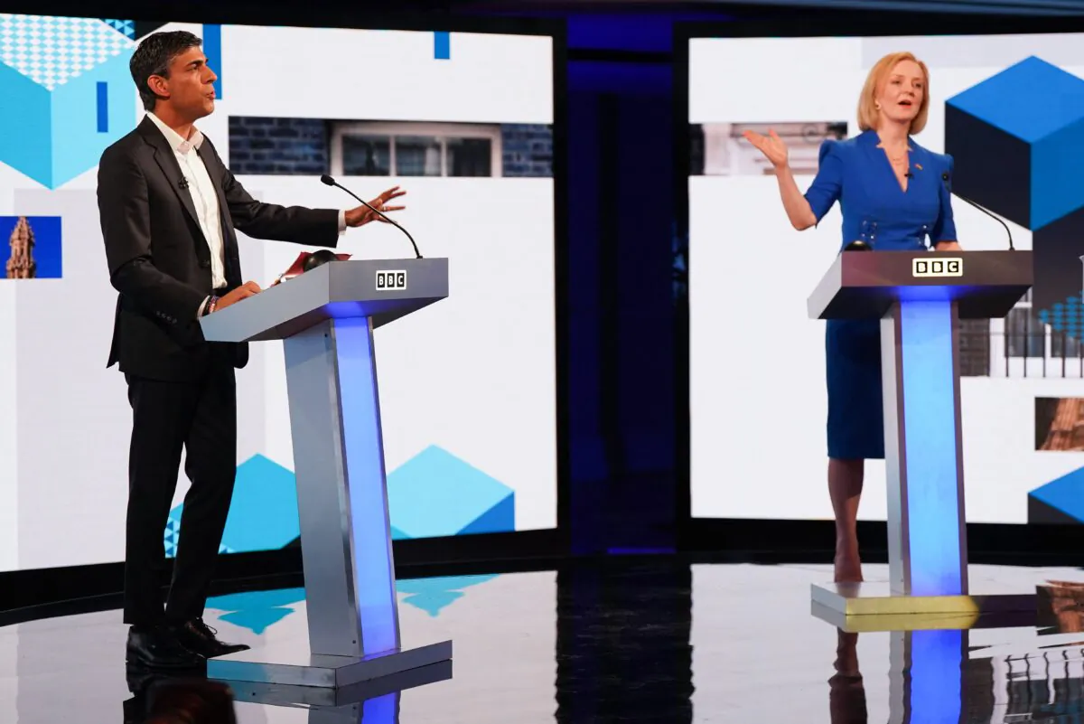 Britain's Foreign Secretary Liz Truss (R) and former chancellor of the exchequer Rishi Sunak, contenders to become the country's next prime minister, take part in the BBC's 'The UK's Next Prime Minister: The Debate,' in Victoria Hall in Stoke-on-Trent, central England, on July 25, 2022. (Jacob King/Pool/AFP via Getty Images)