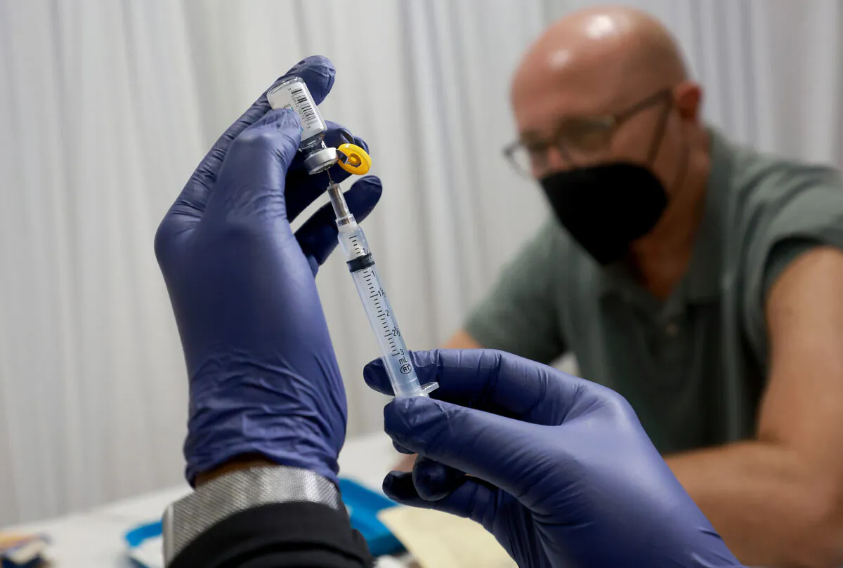 A health care worker prepares to administer a vaccine for the prevention of monkeypox in Wilton Manors, Fla., on July 12, 2022. (Joe Raedle/Getty Images)