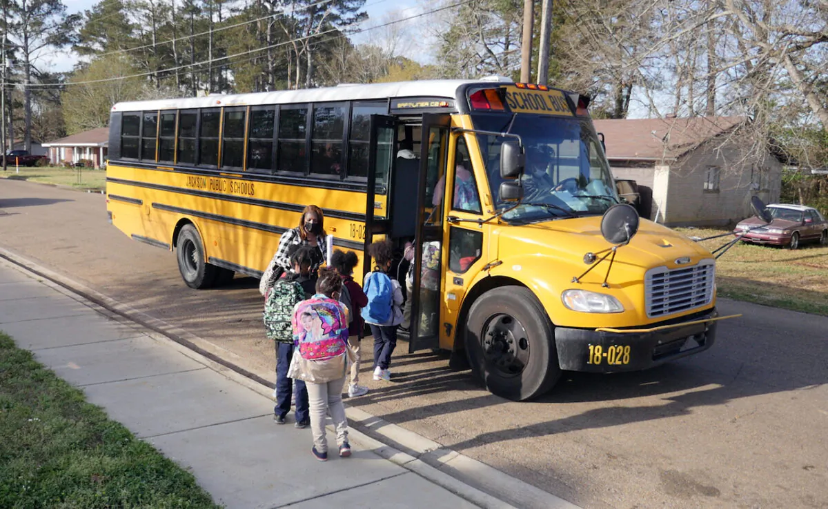 Children leave Wilkins Elementary school in in Jackson, Miss., on March 24, 2022. (Francois Picard/AFP via Getty Images)