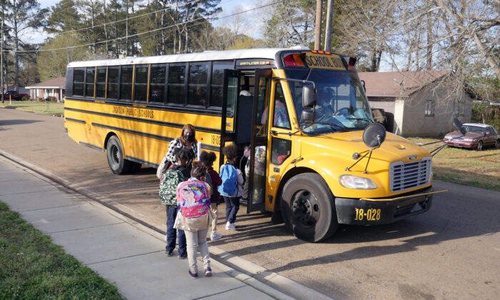 Children leave Wilkins Elementary school in in Jackson, Miss., on March 24, 2022. (Francois Picard/AFP via Getty Images)