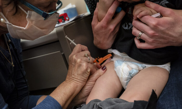 A 20-month-old baby receives the first dose of the Pfizer COVID-19 vaccination at UW Medical Center in Seattle, Washington, on June 21, 2022. (David Ryder/Getty Images)