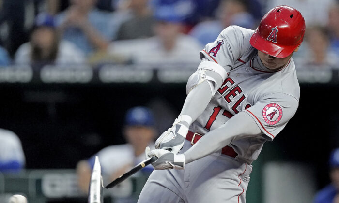 Los Angeles Angels' Shohei Ohtani breaks his bat as he hits a foul ball during the fifth inning of a baseball game against the Kansas City Royals in Kansas City, Mo., on July 26, 2022. (Charlie Riedel/AP Photo)