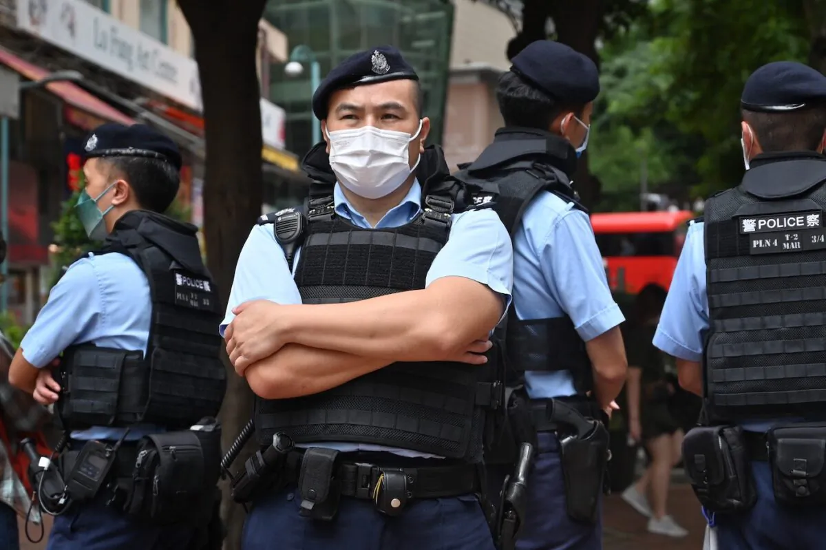 Police stand guard in the Causeway Bay district of Hong Kong on June 4, 2022. (Peter Parks/AFP via Getty Images)