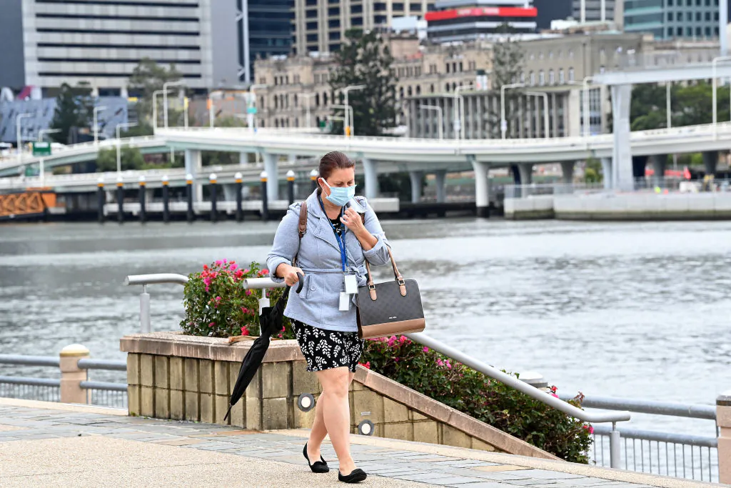 A lady is seen going for her morning walk wearing her mask at Southbank, Brisbane in Australia on Sept. 29, 2021. (Bradley Kanaris/Getty Images)