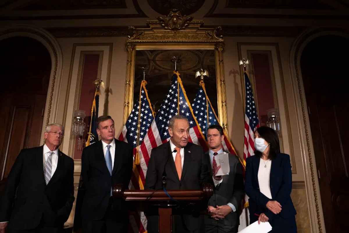 Senate Majority Leader Chuck Schumer, (D-N.Y.), speaks alongside a bipartisan group of senators, including (L-R) Sen. Roger Wicker (R-Miss.), Sen. Mark Warner (D-Va.), Sen. Todd Young (R-Ind.), and Sen. Maria Cantwell (D-Wash.) following the passage of the Creating Helpful Incentives to Produce Semiconductors (CHIPS) for America Act on July 27, 2022 in Washington (Nathan Howard/Getty Images)