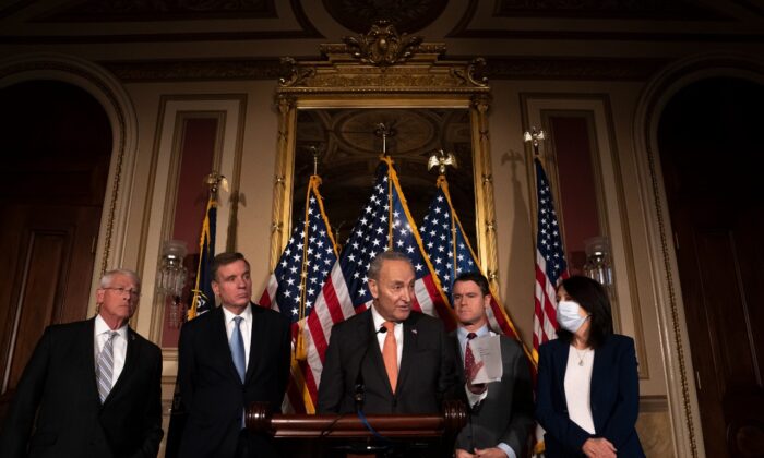Senate Majority Leader Chuck Schumer, (D-N.Y.), speaks alongside a bipartisan group of senators, including (L-R) Sen. Roger Wicker (R-Miss.), Sen. Mark Warner (D-Va.), Sen. Todd Young (R-Ind.), and Sen. Maria Cantwell (D-Wash.) following the passage of the Creating Helpful Incentives to Produce Semiconductors (CHIPS) for America Act on July 27, 2022 in Washington (Nathan Howard/Getty Images)