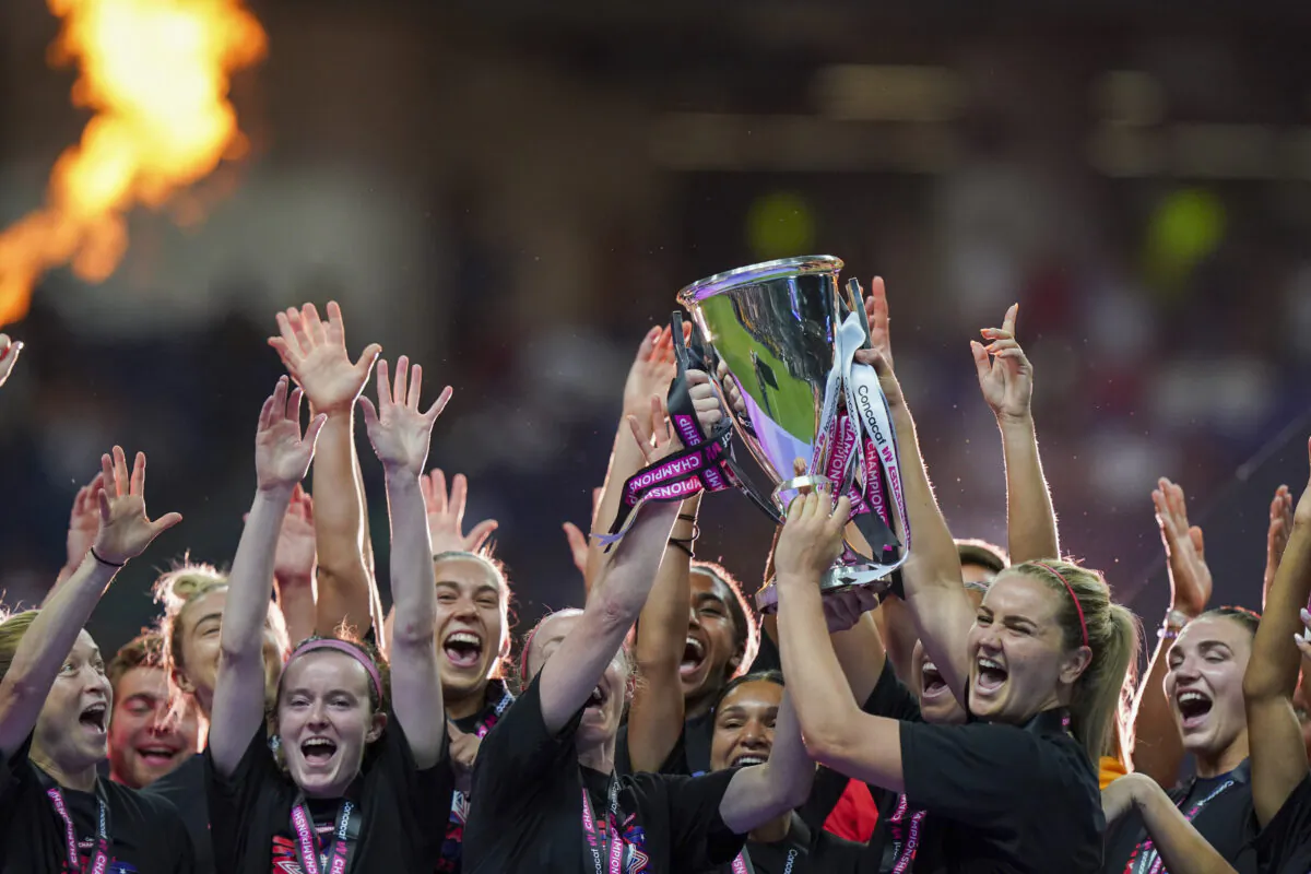 United States' players hold the trophy as they celebrate winning the CONCACAF Women's Championship final soccer match against Canada in Monterrey, Mexico, Monday, July 18, 2022. (Fernando Llano/AP Photo)