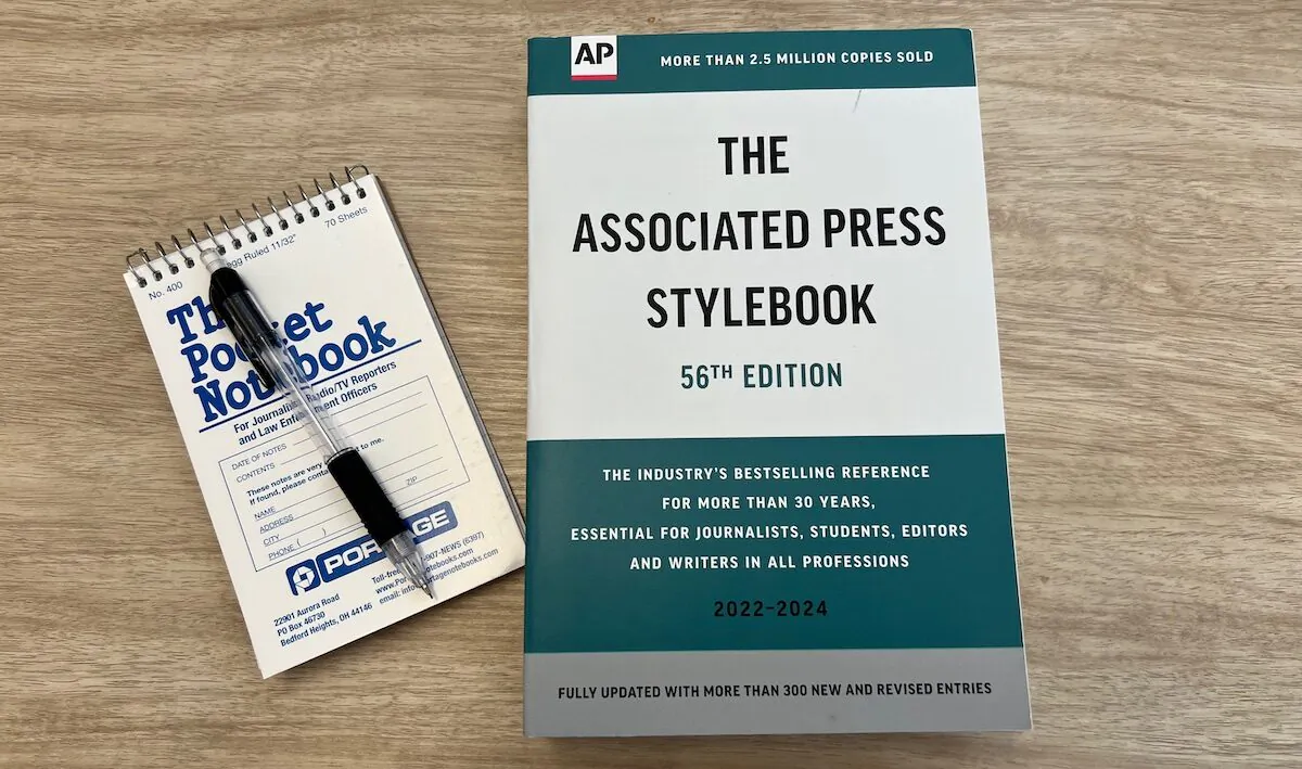 A copy of the Associated Press Stylebook and a reporter's pad in New York on July 27, 2022. (Epoch Times Staff)