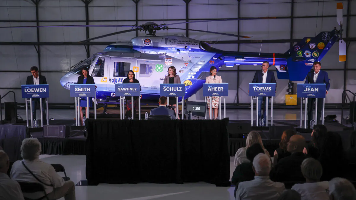 United Conservative Party of Alberta leadership candidates (L–R) Todd Loewen, Danielle Smith, Rajan Sawhney, Rebecca Schulz, Leela Aheer, Travis Toews, and Brian Jean attend the party leadership candidates' debate in Medicine Hat, Alta., on July 27, 2022. (THE CANADIAN PRESS/Jeff McIntosh)