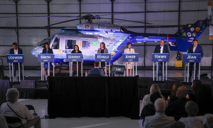United Conservative Party of Alberta leadership candidates (L–R) Todd Loewen, Danielle Smith, Rajan Sawhney, Rebecca Schulz, Leela Aheer, Travis Toews, and Brian Jean attend the party leadership candidates' debate in Medicine Hat, Alta., on July 27, 2022. (THE CANADIAN PRESS/Jeff McIntosh)