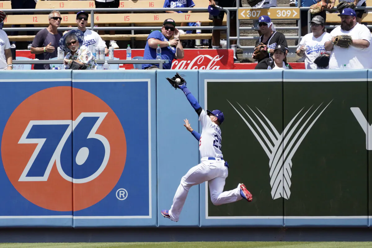 Los Angeles Dodgers center fielder Trayce Thompson makes a leaping catch on a line drive from Washington Nationals' Luis Garcia during the fifth inning of a baseball game at Dodger Stadium, in Los Angeles, on July 27, 2022. (Marcio Jose Sanchez/AP Photo)