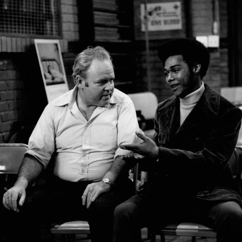Publicity photo from the television program All in the Family. Pictured are Carroll O'Connor (Archie Bunker) and Michael Evans (Lionel Jefferson). via Wikimedia