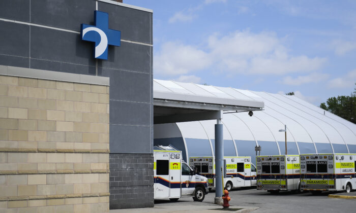 Ambulances are parked outside the Emergency Department at the Ottawa Hospital Civic Campus in Ottawa on May 16, 2022. (Justin Tang/The Canadian Press)