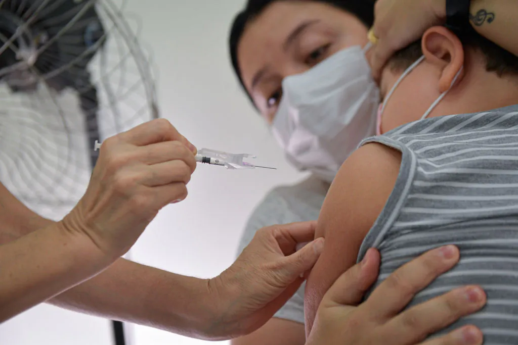 A child under 12 years old receives a dose of Pfizer vaccine in Belo Horizonte, Brazil, on Jan. 18, 2022. (Pedro Vilela/Getty Images)