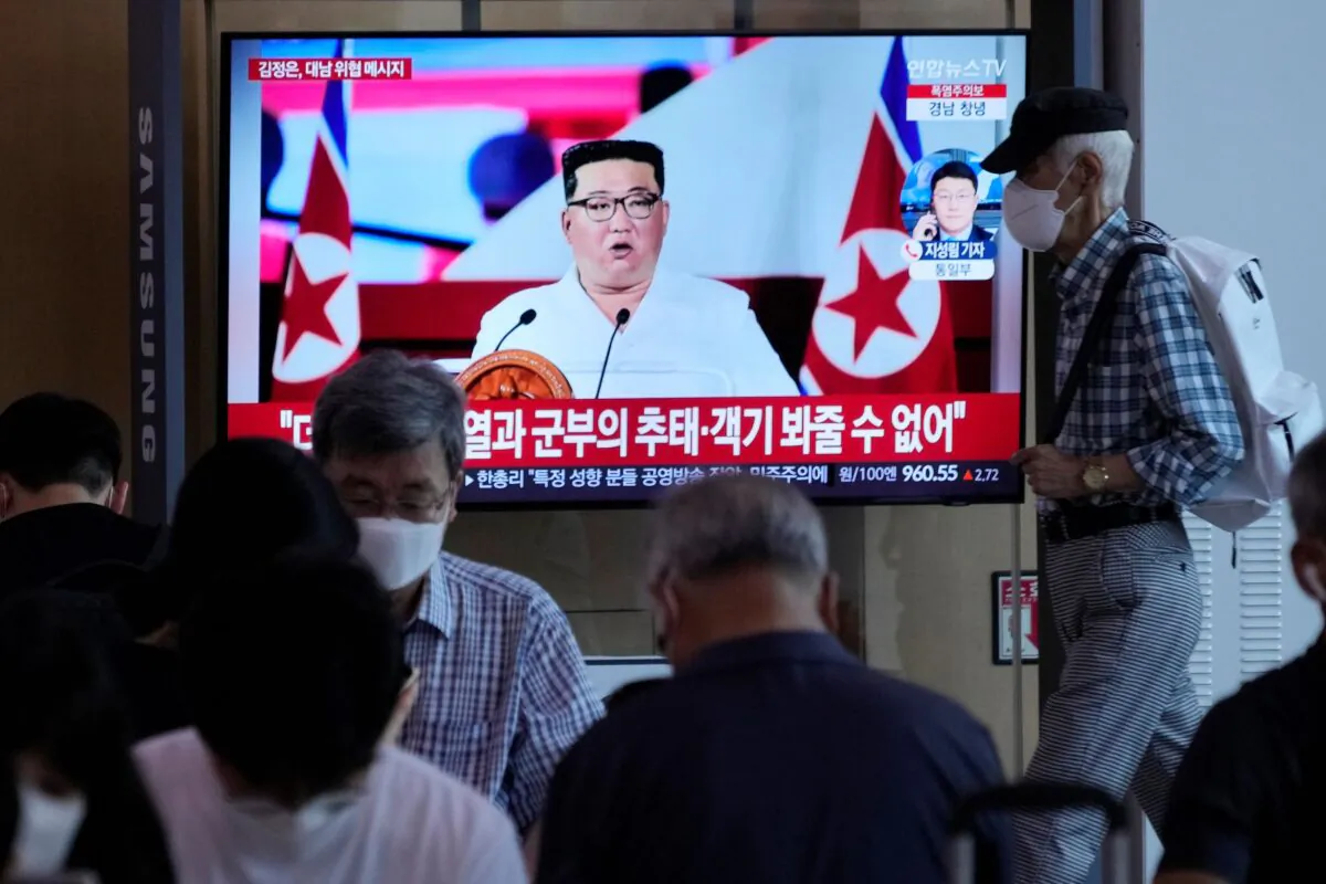 People watch a TV showing an image of North Korea leader Kim Jong Un, during a news program at the Seoul Railway Station in Seoul, South Korea on July 28, 2022. (Ahn Young-joon/AP Photo)