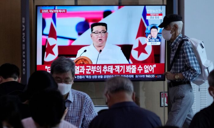 People watch a TV showing an image of North Korea leader Kim Jong Un, during a news program at the Seoul Railway Station in Seoul, South Korea on July 28, 2022. (Ahn Young-joon/AP Photo)