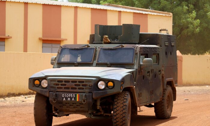 The vehicle of the FAMA (Mali Armed Forces) patrols in the street in a file photo. (Souleymane Aganara/AFP via Getty Images)