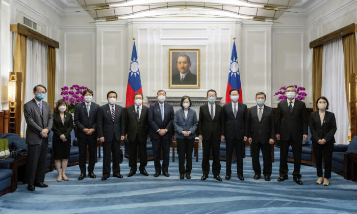 Taiwan's President Tsai Ing-wen (center) and Taiwanese officials pose for photos with a Japanese delegation at the Presidential office in Taipei, Taiwan on July 28, 2022. (Taiwan Presidential Office via AP)