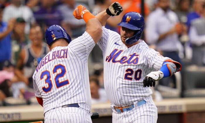 New York Mets' Pete Alonso (20) celebrates with Daniel Vogelbach (32) after hitting a home run against the New York Yankees during the second inning of a baseball game, in New York on July 27, 2022. (Frank Franklin II/AP Photo)