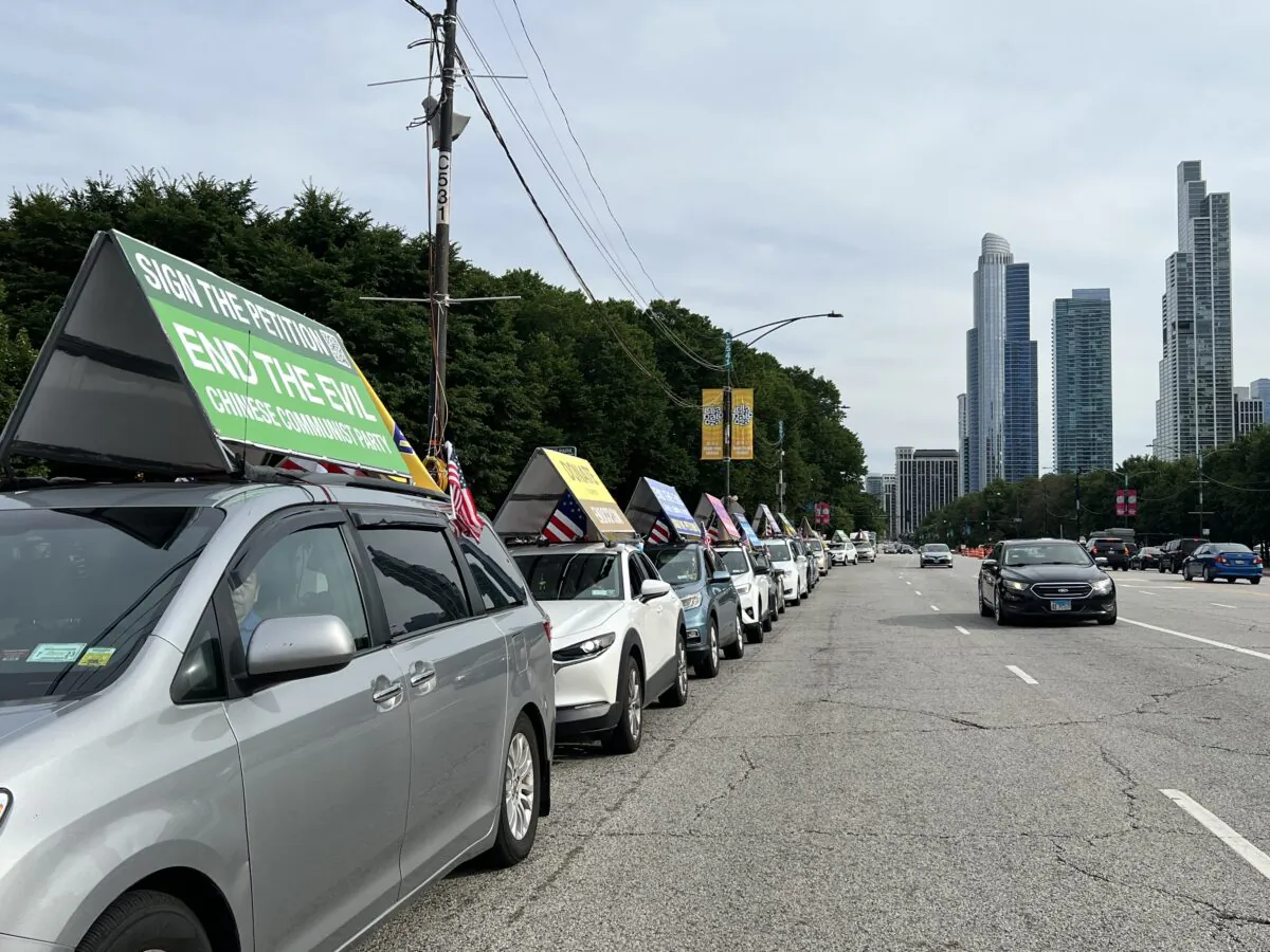 The 4th EndCCP Tour of America passing through Chicago downtown on July 25, 2022. (Sarah Lu/Epoch Times)