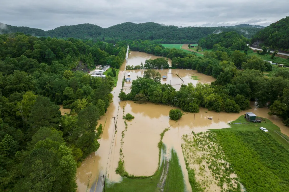 Buildings and roads are flooded near Wolverine, Ky., on July 28, 2022. (Ryan C. Hermens/Lexington Herald-Leader via AP)