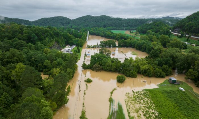 Buildings and roads are flooded near Wolverine, Ky., on July 28, 2022. (Ryan C. Hermens/Lexington Herald-Leader via AP)