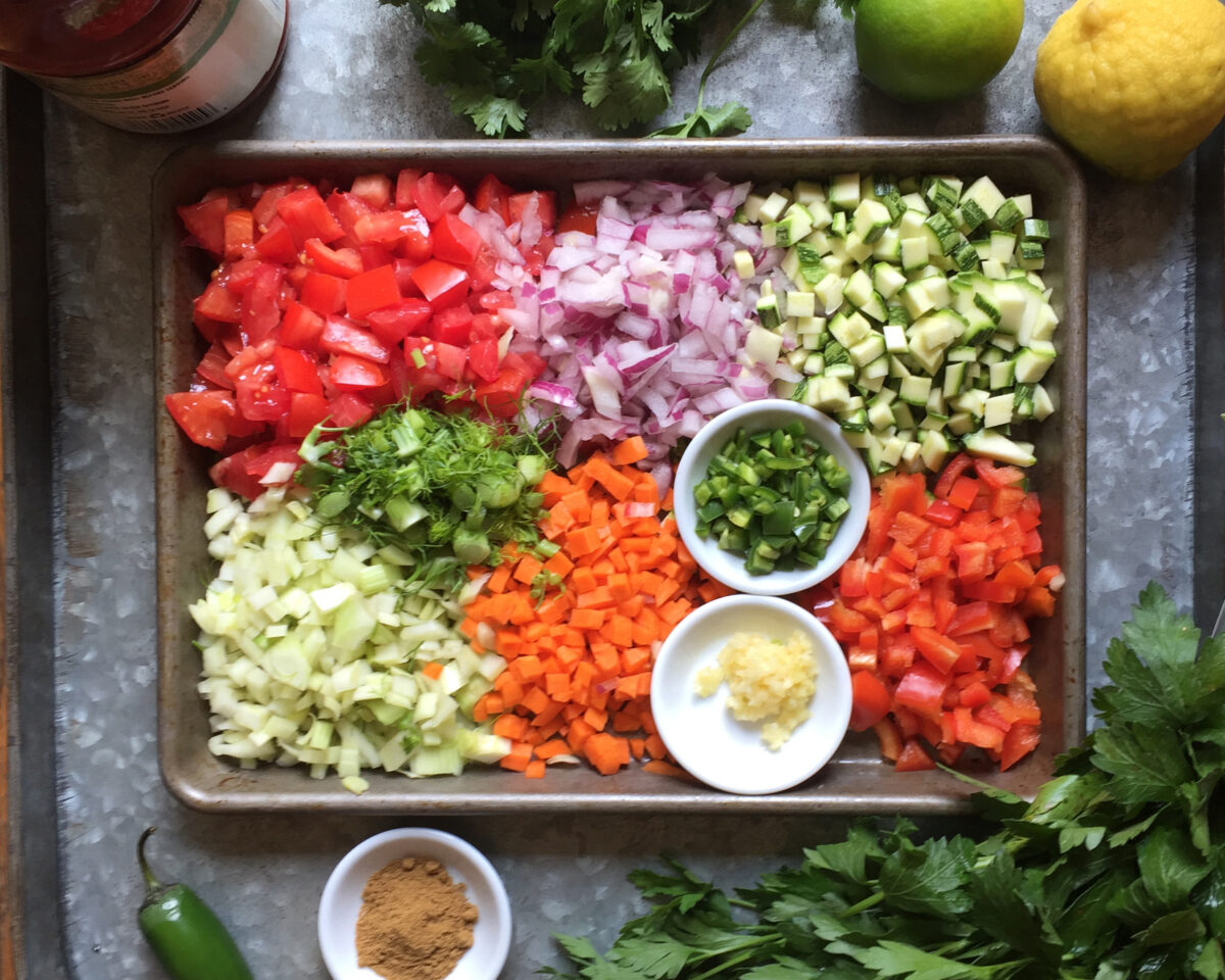 This chunky, crunchy gazpacho recipe calls for chopping and dicing a medley of vegetables to tumble into a bath of citrusy, spice-infused tomato juice. (Lynda Balslev for Tastefood)