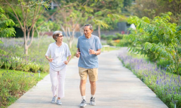 Retired asian couple running. Study finds that people with sedentary lifestyle and unhealthy sleep behaviors are prone to fatty liver.
(fotogenicstudio/Shutterstock)