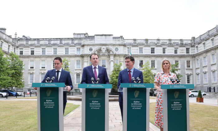 (L-R) Minister Martin Heydon, Charlie McConalogue, Mininster Eamon Ryan, and Minister Pippa Hackett speaking about reducing greenhouse gas emissions at a press conference at government Buildings in Dublin on July 28, 2022. (Government of Ireland handout via PA Media)