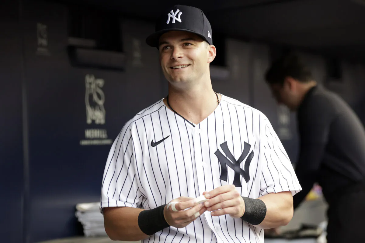 Andrew Benintendi #18 of the New York Yankees in the dugout before taking on the Kansas City Royals at Yankee Stadium in New York on July 28, 2022. (Adam Hunger/Getty Images)