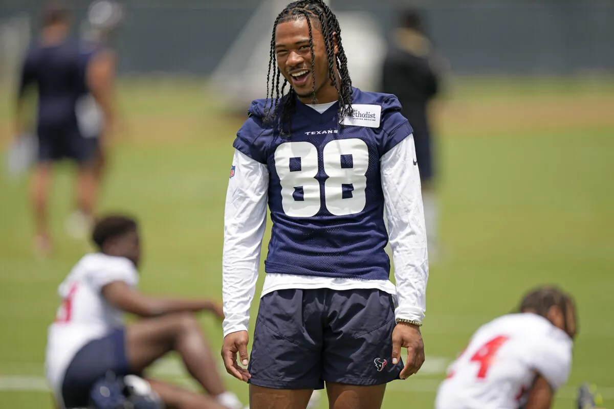 John Metchie III of Houston Texans smiles during an NFL football rookie minicamp practice in Houston on May 13, 2022. (David J. Phillip/AP Photo)