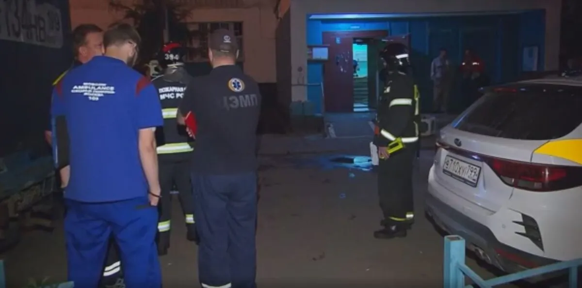 Emergency workers at the scene of a fire at a hostel in Moscow on July 29, 2022, in a still from video. (RU-RTR via AP/Screenshot via The Epoch Times)