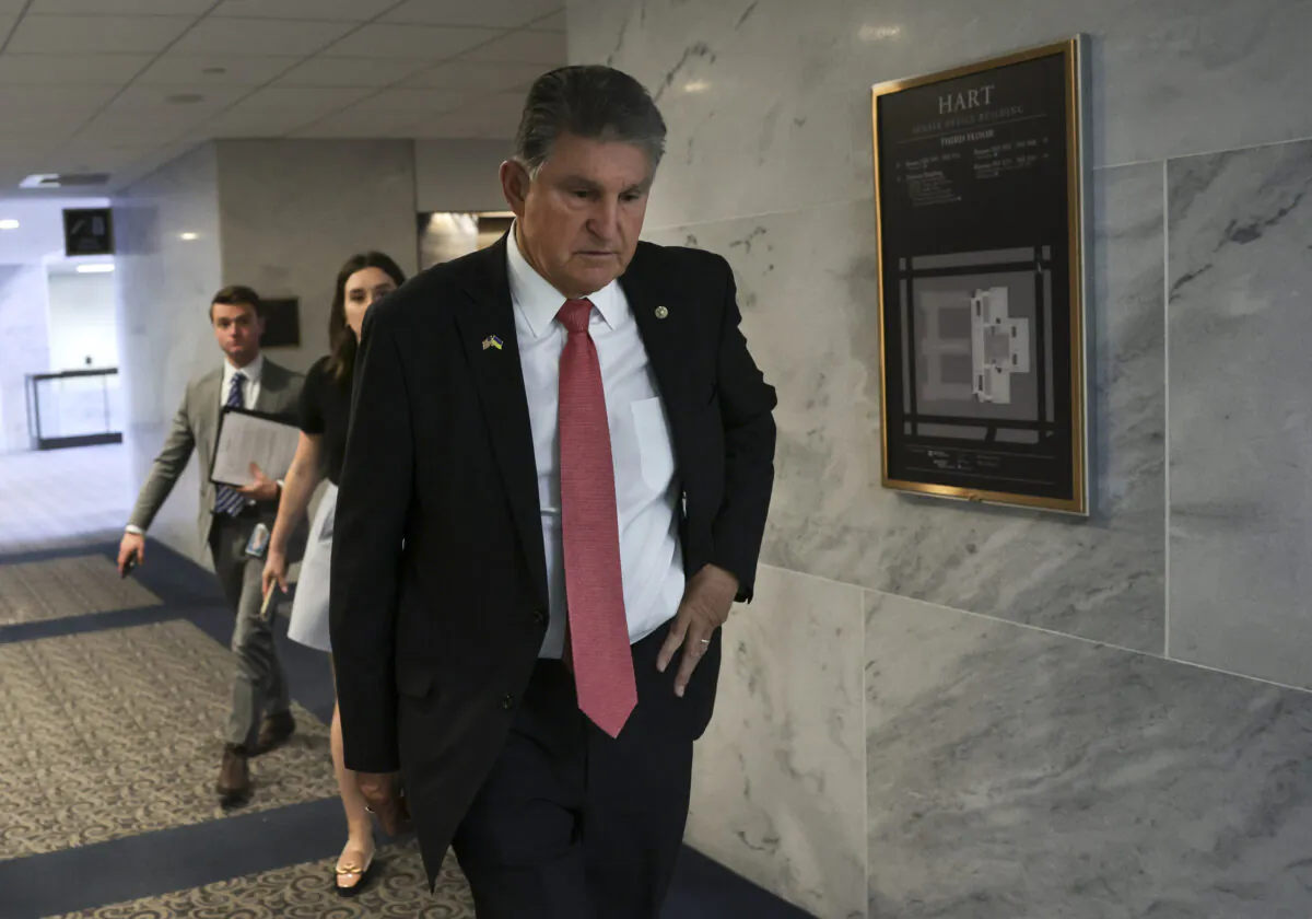 Sen. Joe Manchin (D-W.Va.) walks after a vote on the Women's Health Protection Act at the Hart Senate Office Building on May 11, 2022. (Kevin Dietsch/Getty Images)