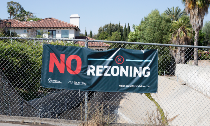 Signs hang in opposition to proposed locations city officials are considering to zone for housing in Yorba Linda, Calif., on July 27, 2022. (John Fredricks/The Epoch Times)