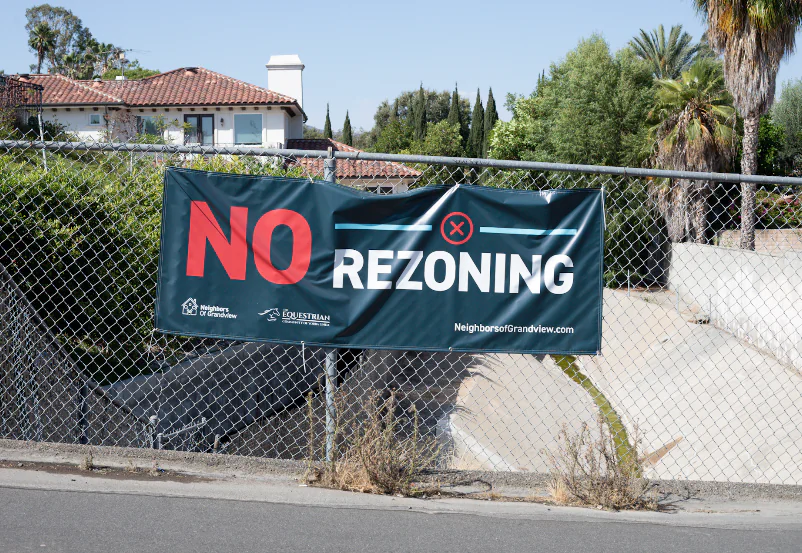 Signs hang in opposition to proposed locations city officials are considering to zone for housing in Yorba Linda, Calif., on July 27, 2022. (John Fredricks/The Epoch Times)