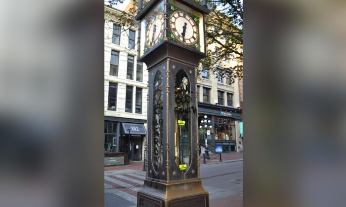 The Gastown steam clock in Vancouver is seen spraypainted with slogans in this image provided by the Save Old Growth activist group on July 28, 2022. (The Canadian Press/HO-Save Old Growth)