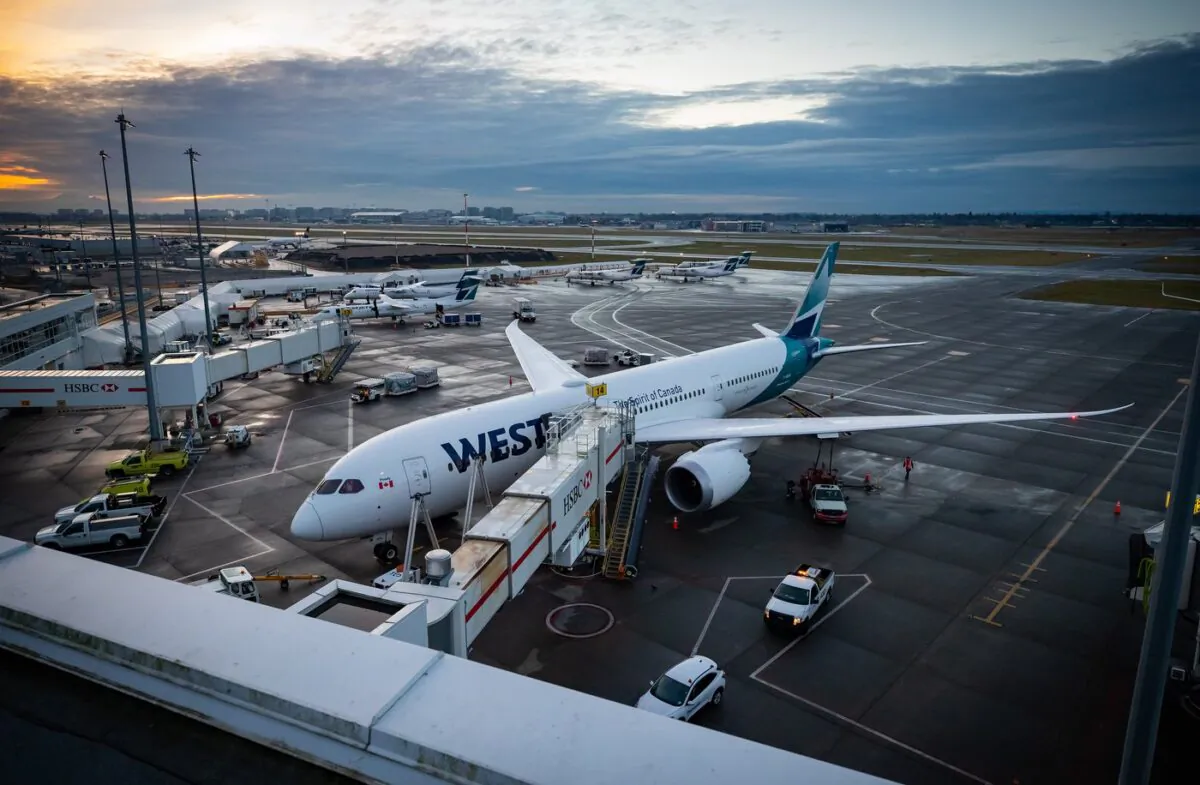 A WestJet Airlines Boeing 787-9 Dreamliner is seen parked at a gate at Vancouver International Airport in Richmond, B.C., on Jan. 21, 2021. (The Canadian Press/Darryl Dyck)