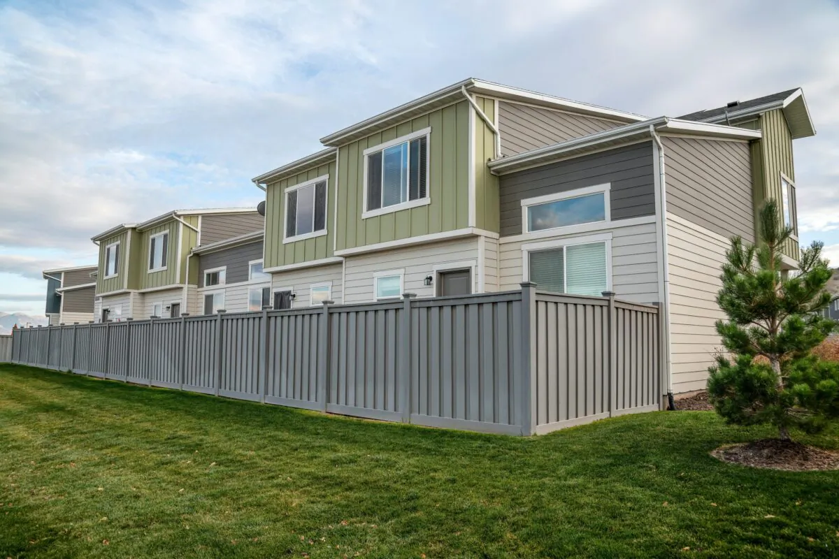 Board and batten fences are one of the simplest designs to build yourself and also can also serve as a windbreak.(Jason Finn/Shutterstock)